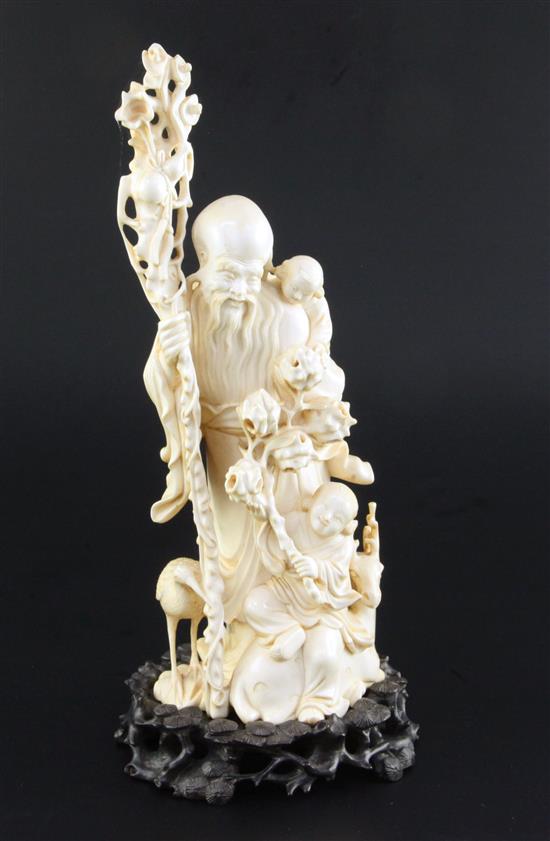 A Chinese ivory group of Shou Lao, early 20th century, total height 27.5cm